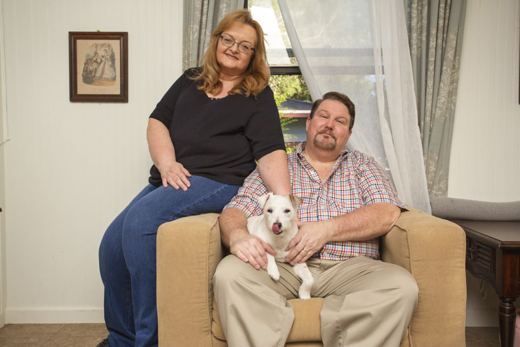 couple poses with their dog for jessica shaw photography lifestyle pet photography based in tampa